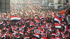 Thousands of Iraqis have defied a protest ban and rallied in the heart of the capital, Baghdad, to demand an end to sectarianism and corruption.