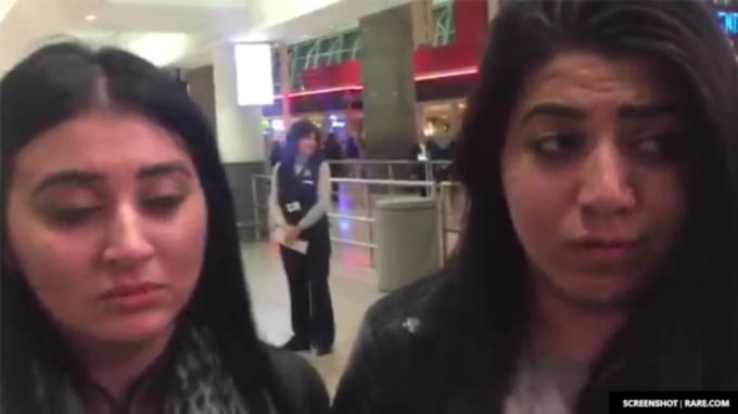 Two girls can barely hold back tears as they wait to find out if their Iraqi mother will be allowed into the United States