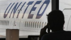 WATCH: Man forcibly removed from overbooked United flight