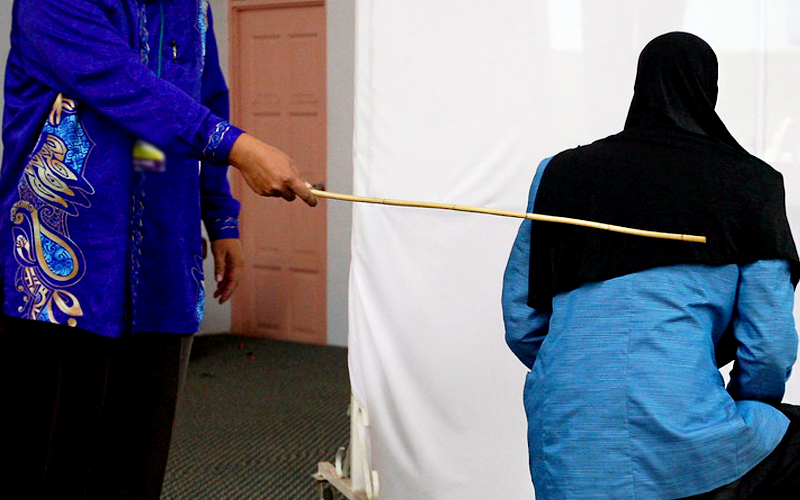 Two women were caned in front of 100 people in a shariah court in Terengganu on Sept 3 for attempting to commit lesbian sex. (Bernama pic)