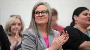 Arizona Governor Katie Hobbs speaking at a press conference regarding state legislative vetoes.